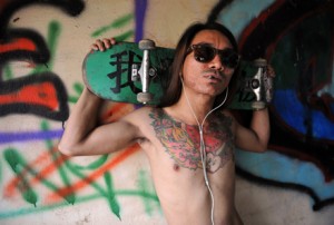 A Burmese skater posing with his board at Nanat Taw Bridge in Yangon. Photo by Ye Aung Thu/ AFP.