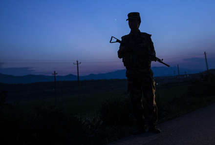 A Chinese soldier patrols the border with Myanmar. Photo by AFP.