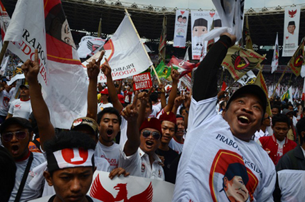 Indonesians show their support for Prabowo at a Jakarta rally. Could  their vote for him be their last? Photo by AFP.
