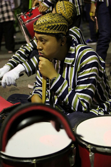 A band member waits his turn to join the carnival.