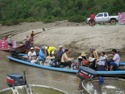 Shan migrants on a boat crossing Salween River. 