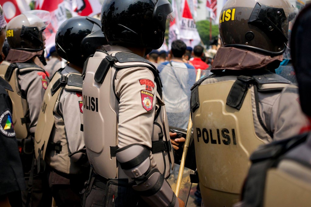 Prabowo's supporters meet a wall of police.