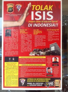A poster hanging on the front door of a sub-district police station in central Jakarta, September 2014. Photo: Dominic Berger