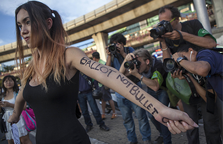 An anti-coup protestor demonstrates in Bangkok on 24 May, 2014. Photo by AFP.
