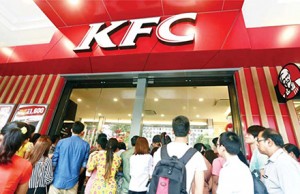 Locals queue for the opening of Myanmar's first KFC in Yangon.