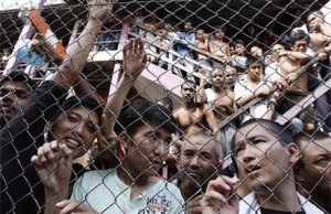Men in an immigration detention centre, Malaysia. Photo by AP.