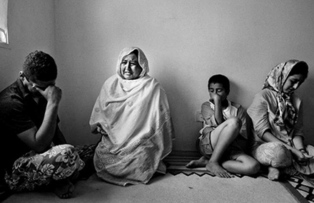 An Afghan family of refugees residing in Malaysia. Photo by UNHCR.