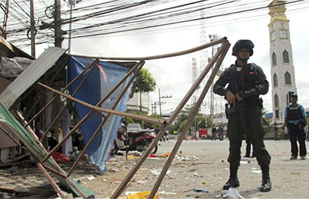 Thai soldiers and police officers at the scene of a bomb attack in Pattani province, southern Thailand Photo: EPA. 