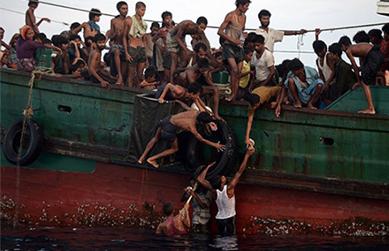 Rohingya stranded off the coast of Thailand in May. Photo: Christophe Archambault/AFP. 