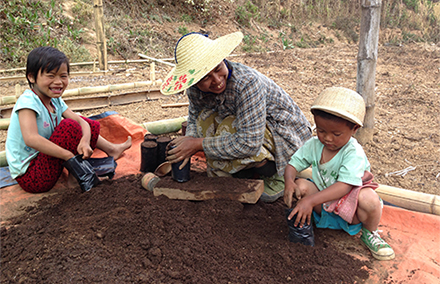 Local farmers in Shan state pack coffee. Photo: Charlie Artingstoll.