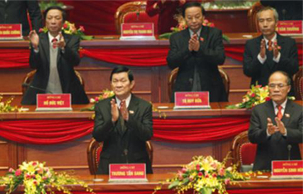 Vietnam's Communist Party leaders applaud upon their arrival at the opening ceremony of the 11th National Party Congress. Photo: AP. 