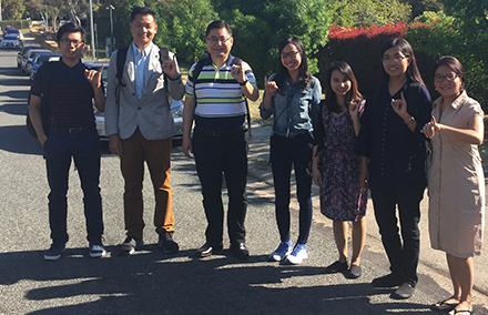 Chit Win (third from left) and fellow ANU students from Myanmar show their inked-stained thumbs. 