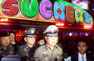 Somyot Pumpanmuang, speaks to reporters about the Bangkok blast investigation in front of a popular go-go bar тАЬSuckersтАЭ . Photo: Royal Thai Police