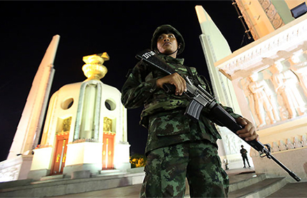 A Thai soldier stands guard in front of the Democracy Monument. Photo: AP Photo/Sakchai Lalit
