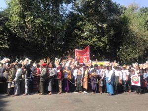 A photograph of demonstrators supporting Daw Aung Suu Kyi
