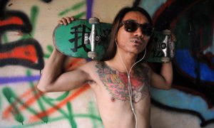 A Burmese skater posing with his board at Nanat Taw Bridge in Yangon. Photo by Ye Aung Thu/ AFP.