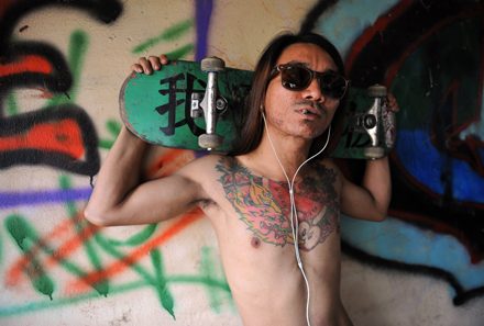 A Burmese skater posing with his board at Nanat Taw Bridge in Yangon. Photo by Ye Aung Thu/ AFP.