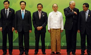 No longer the odd man out. Myanmar President Thein Sein (third from right) with Southeast Asian leaders at the 24th ASEAN summit. Photo by AFP.