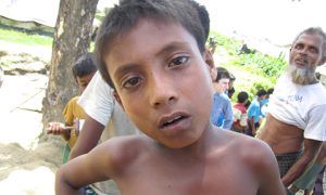 A young Rohingya boy in a camp for the internally displaced. Photo by European Commission DG Echo on flickr https://www.flickr.com/photos/69583224@N05/