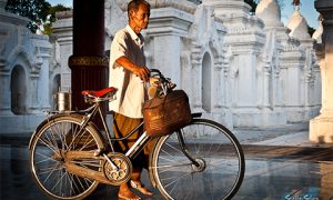Man with his bike. Photo by Staffan Scherz on flickr.