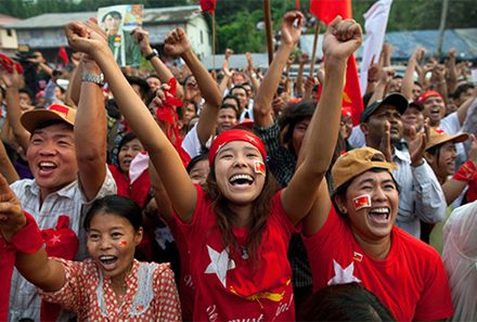National League for Democracy (NLD) supporters celebrate their victory in parliamentary elections outside party headquarters on April 1, 2012 in Yangon, Myanmar. Photo by Paula Bronstein/Getty Images.