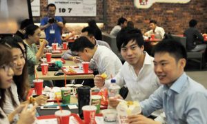 People eat at Yangon's KFC. Photo by AFP.