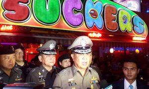 Somyot Pumpanmuang, speaks to reporters about the Bangkok blast investigation in front of a popular go-go bar тАЬSuckersтАЭ . Photo: Royal Thai Police