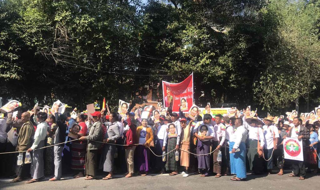 A photograph of demonstrators supporting Daw Aung Suu Kyi